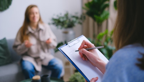 Social Services Worker holding a clipboard