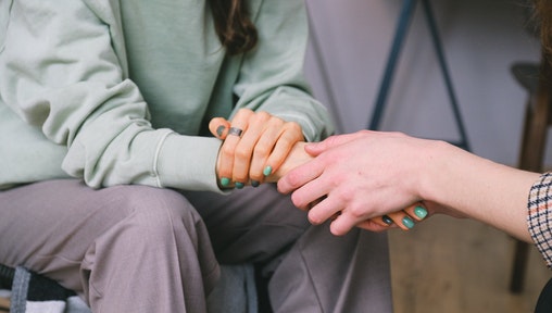Social Services Manager- holding a hand
